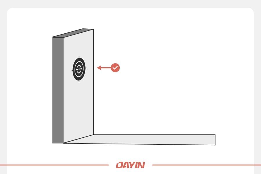 A demonstration of how the dart board should sit flush against the wall.