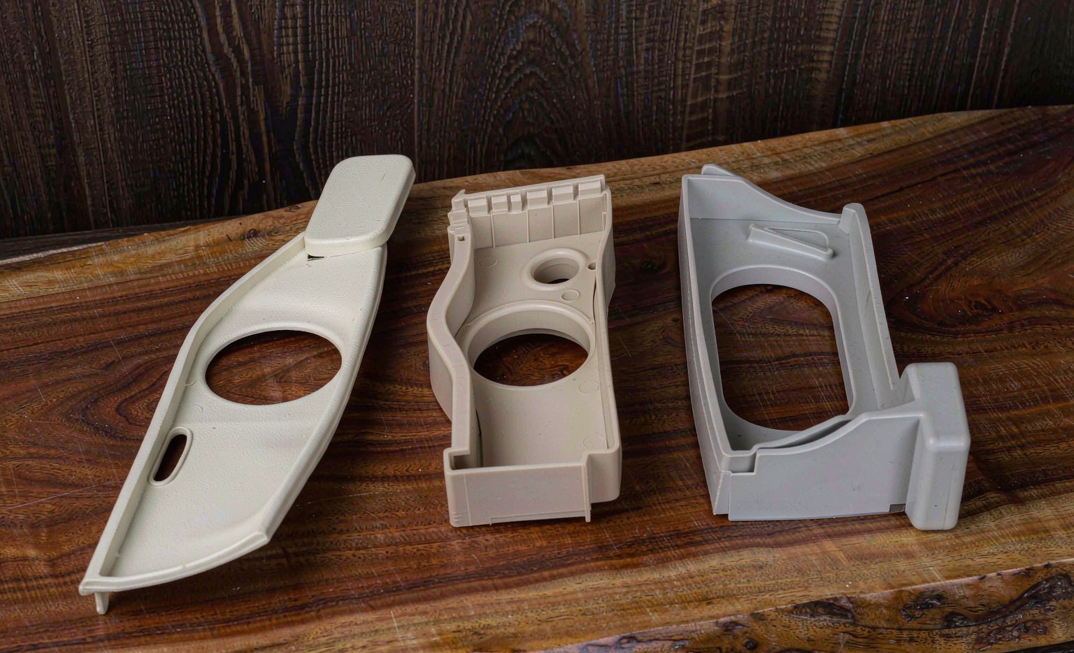 Three molded samples of PP ABS and PC side by side