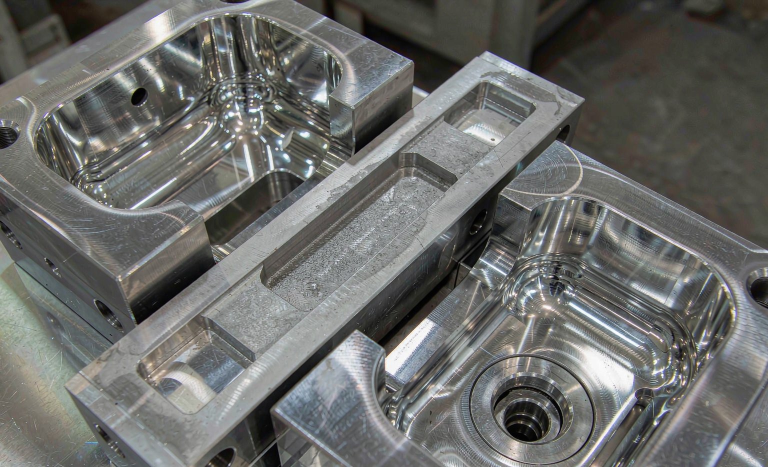 Two-cavity steel injection mold tooling with polished cavities