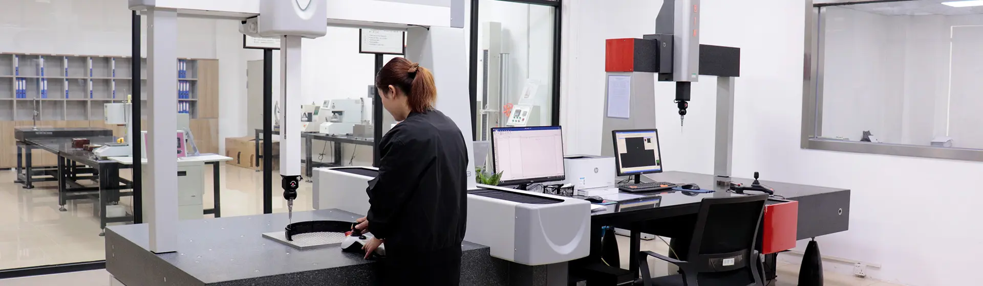 Coordinate measuring machine inspecting injection molded parts in DAYIN lab