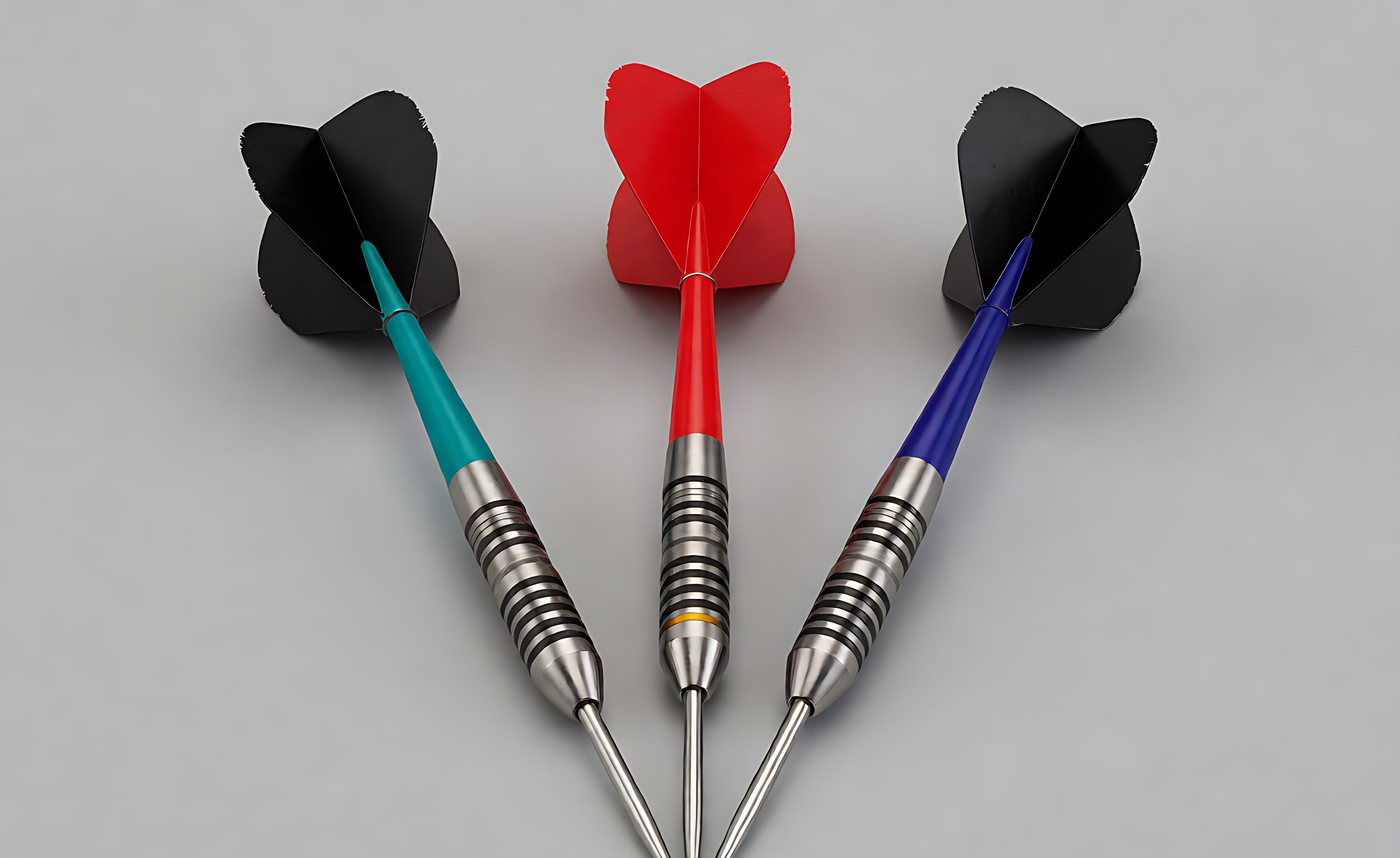 Set of three soft-tip darts with barrels, shafts and flights laid out