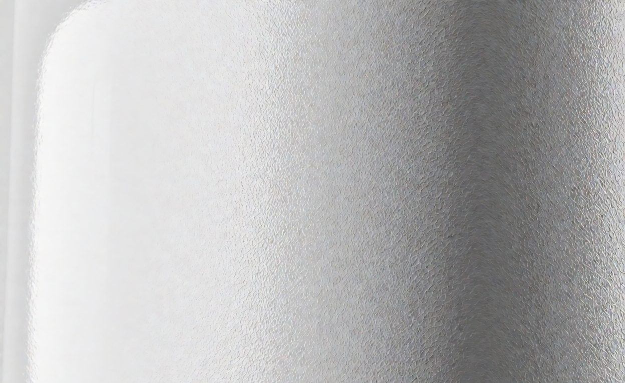 Mold texture versus gloss finish Fine mold texture on a plastic surface beside a glossy area